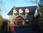 Photo of a stone cottage converted into a three bedroom residence, built by Atfar Construction