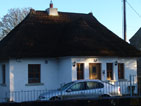 Photo of the construction of a thatched cottage, built by Atfar Construction